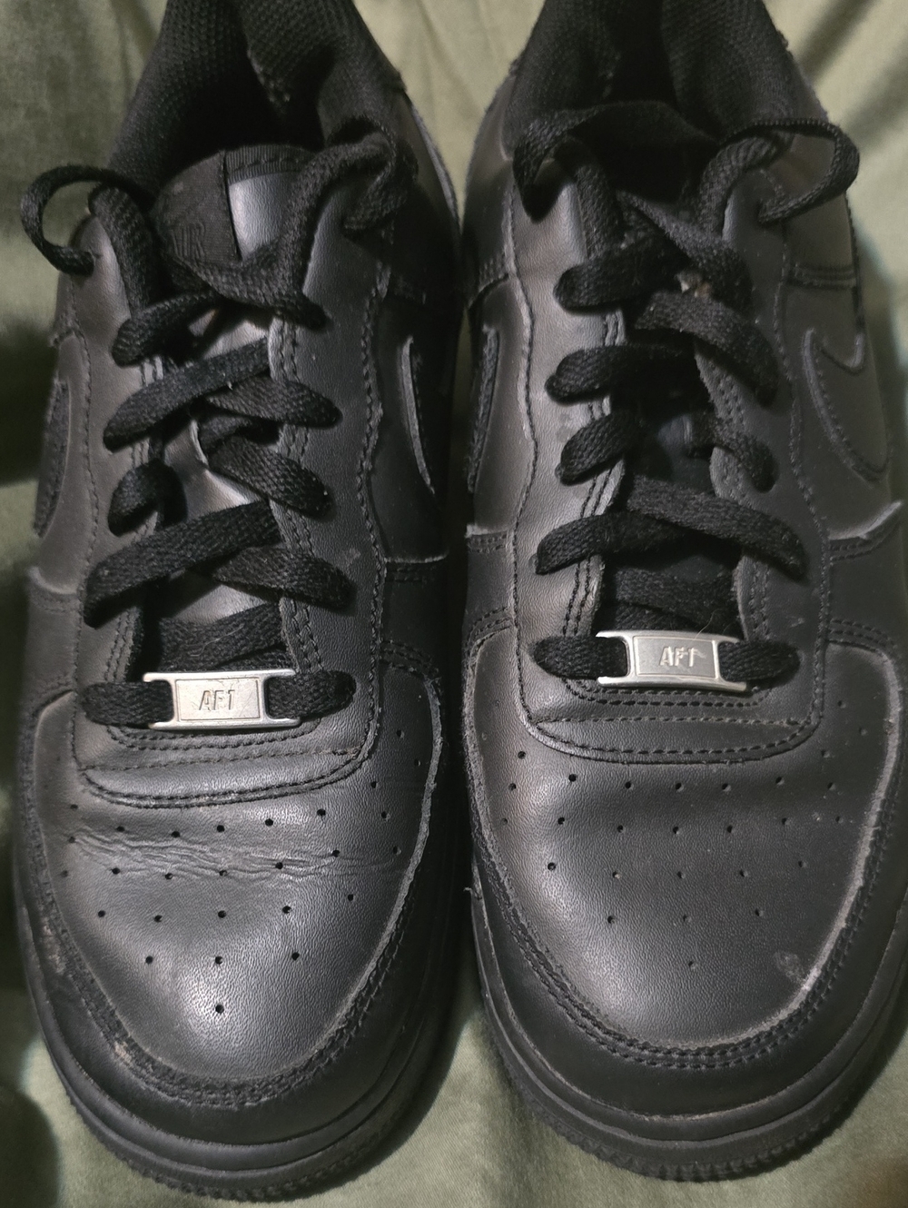 Nike Men’s All-Black Leather Sneakers